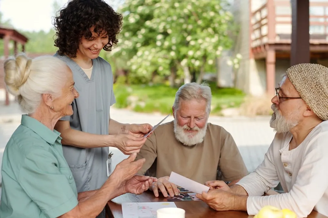 A support worker helping a group with an activity